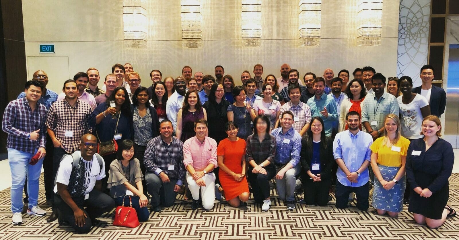 Students smile for the camera at the Singapore conference.